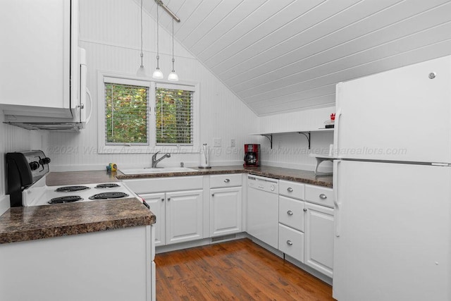 kitchen featuring white cabinetry, sink, wood walls, vaulted ceiling, and white appliances