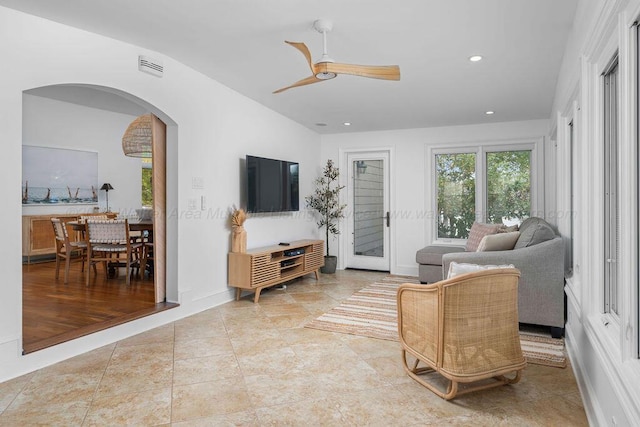 living room featuring ceiling fan and light wood-type flooring