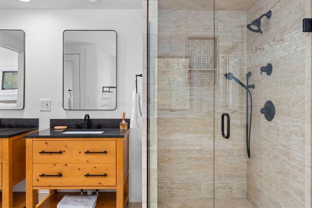 bathroom featuring vanity and walk in shower