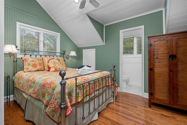 bedroom featuring multiple windows, wood-type flooring, and ceiling fan