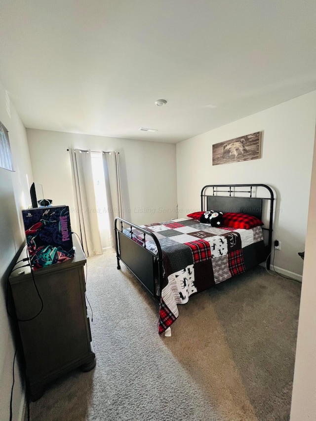 bedroom featuring carpet flooring