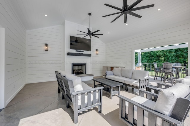 view of patio / terrace with an outdoor living space with a fireplace