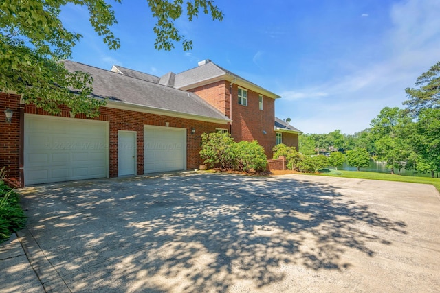 view of side of home featuring a garage