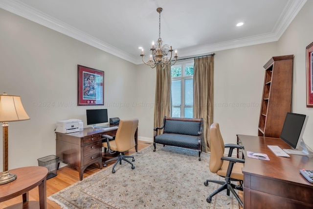 office space with an inviting chandelier, crown molding, and light hardwood / wood-style flooring