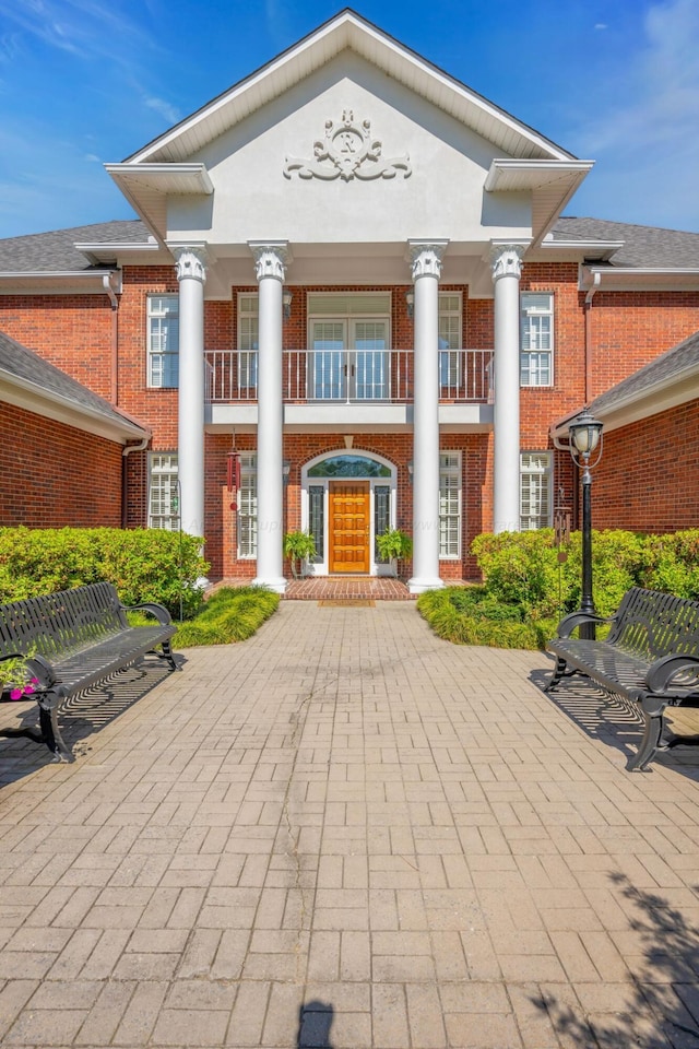 view of front of home with a balcony