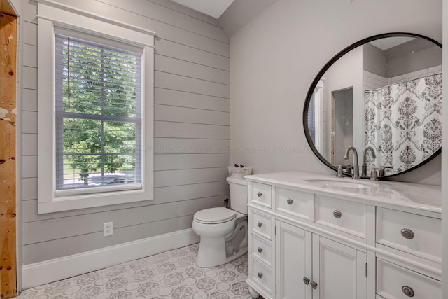 bathroom with baseboards, toilet, a shower with curtain, vanity, and wood walls