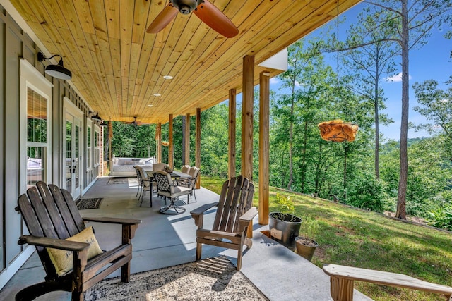 view of patio featuring an outdoor living space, a ceiling fan, and french doors