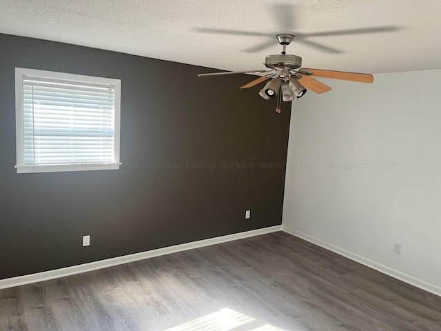 unfurnished room with baseboards, a textured ceiling, wood finished floors, and a ceiling fan