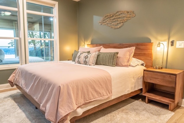 bedroom with light wood-type flooring