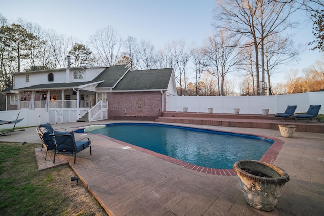 view of swimming pool with a patio