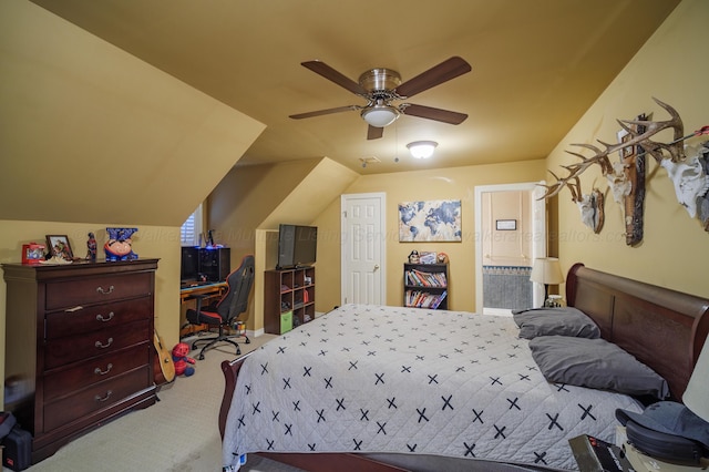 carpeted bedroom with vaulted ceiling, ensuite bath, and ceiling fan