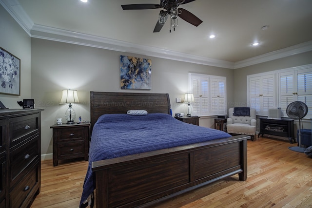 bedroom featuring ceiling fan, light hardwood / wood-style floors, and ornamental molding