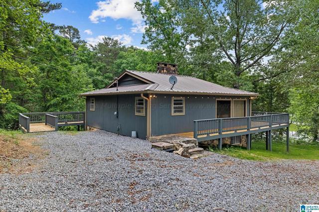 view of home's exterior with a wooden deck