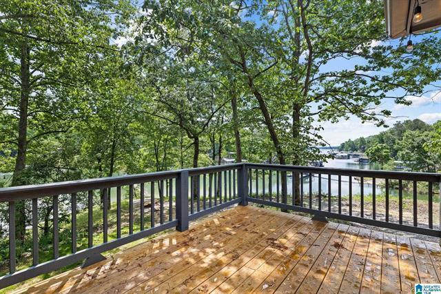 wooden deck featuring a water view