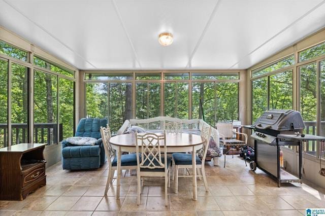 sunroom / solarium featuring a healthy amount of sunlight