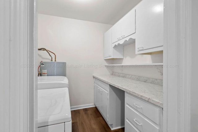 interior space featuring baseboards, open shelves, water heater, dark wood-type flooring, and white cabinets