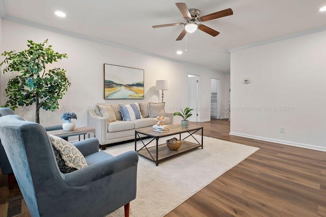 living room with visible vents, baseboards, ornamental molding, recessed lighting, and wood finished floors