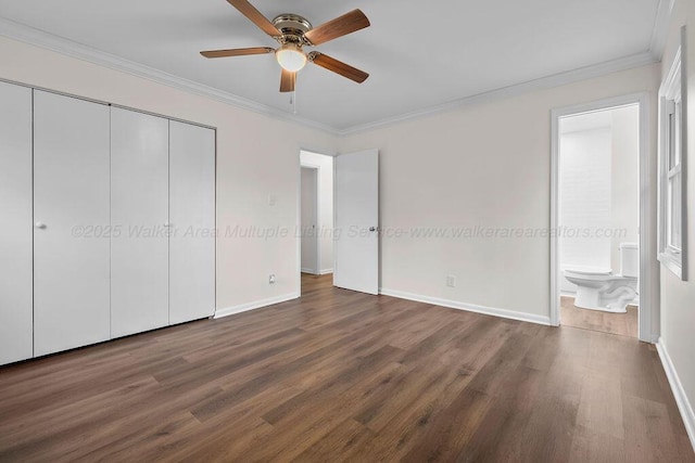 unfurnished bedroom featuring a closet, wood finished floors, ornamental molding, and ensuite bathroom