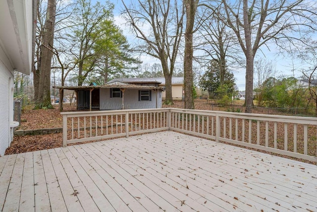 wooden terrace with an outbuilding