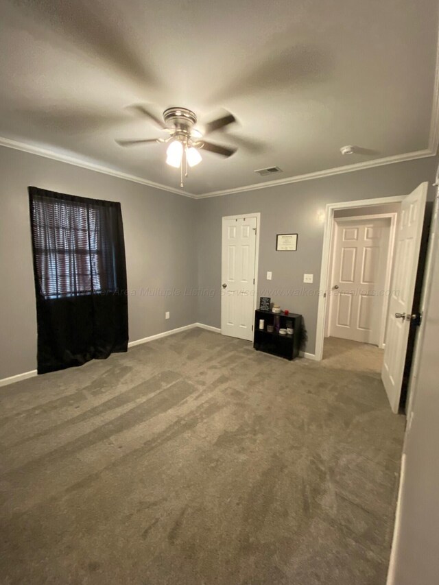 hall featuring carpet floors and ornamental molding