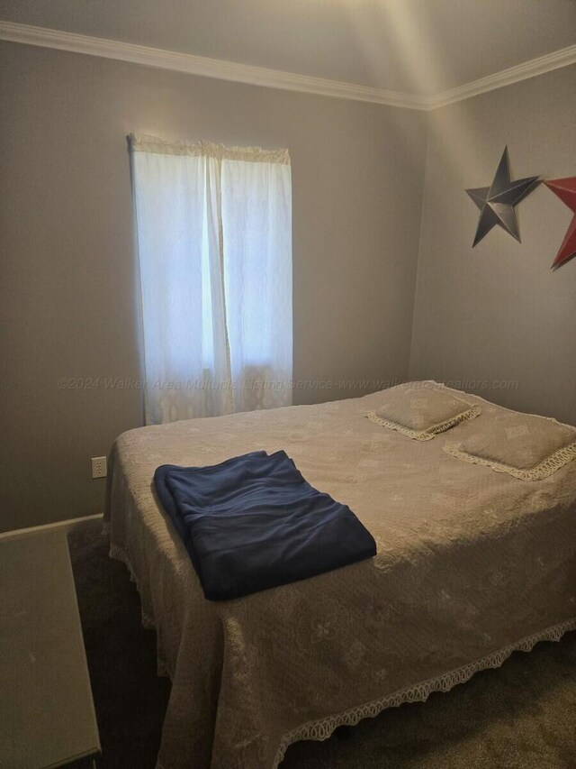 bedroom featuring carpet and crown molding