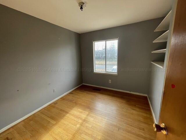 empty room with light wood-type flooring