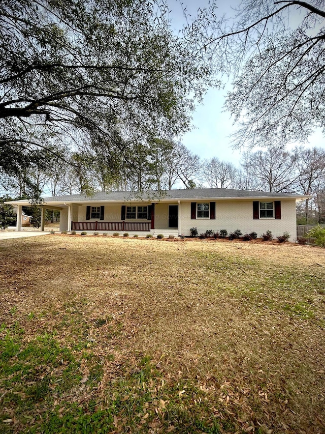 single story home with brick siding and a front lawn