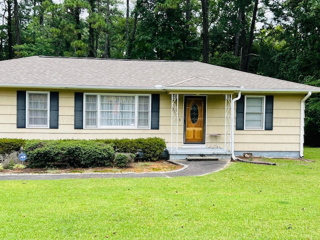 ranch-style house with a front yard