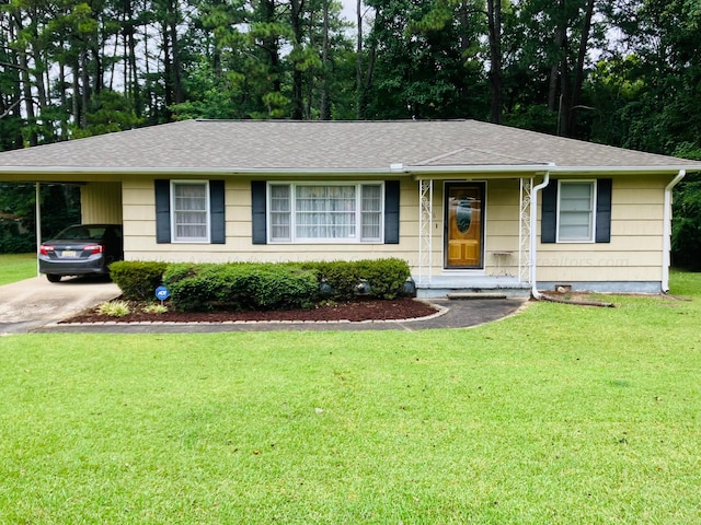 single story home with a front yard and a carport