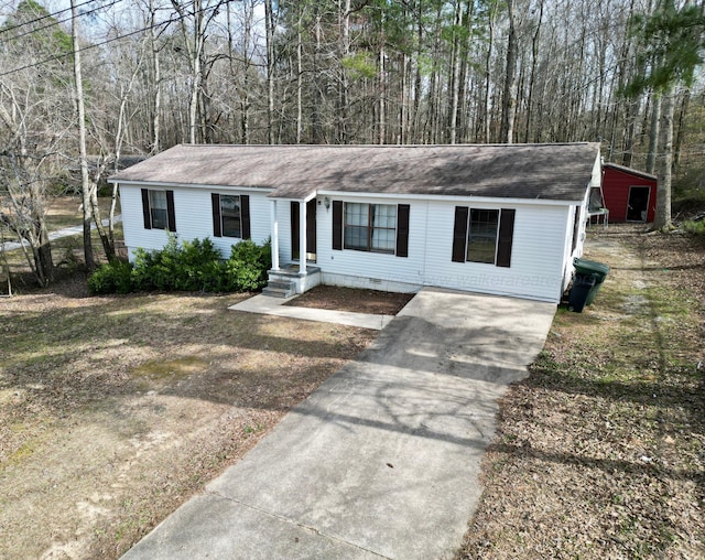 ranch-style house with concrete driveway and crawl space