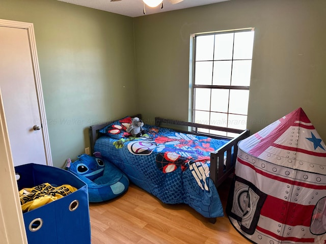 bedroom with wood finished floors