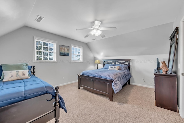 carpeted bedroom with ceiling fan and lofted ceiling