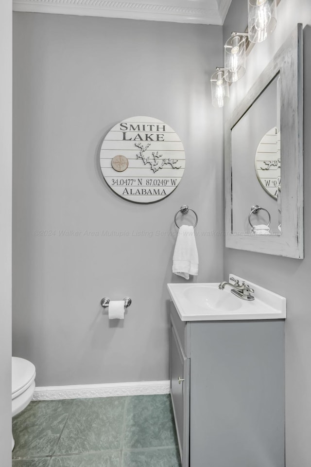 bathroom featuring tile patterned floors, vanity, and toilet