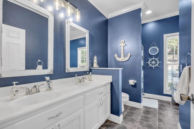 bathroom featuring vanity, toilet, and ornamental molding