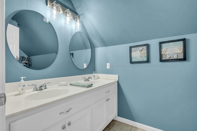 bathroom with tile patterned floors and vanity