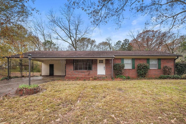 ranch-style home with a front yard and a carport