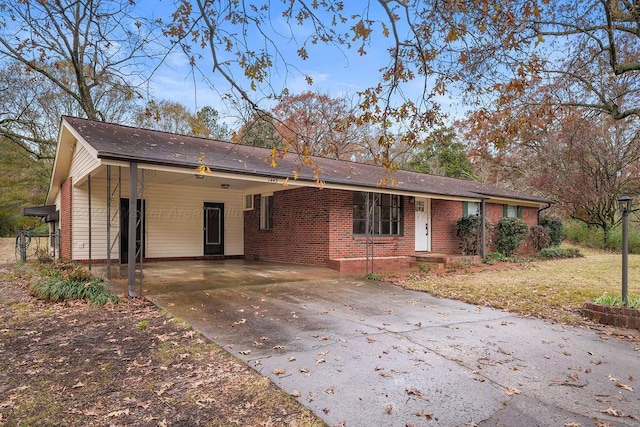 ranch-style home with a carport