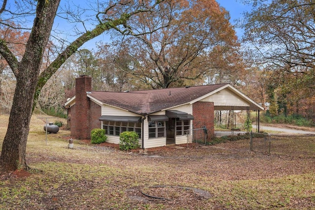 exterior space featuring a carport