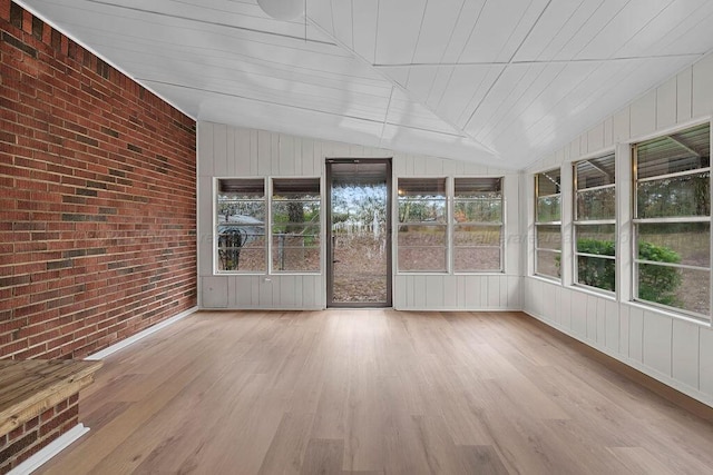 unfurnished sunroom with wooden ceiling and vaulted ceiling