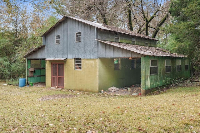 view of property exterior with a lawn