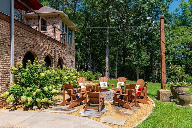 view of patio / terrace featuring an outdoor fire pit