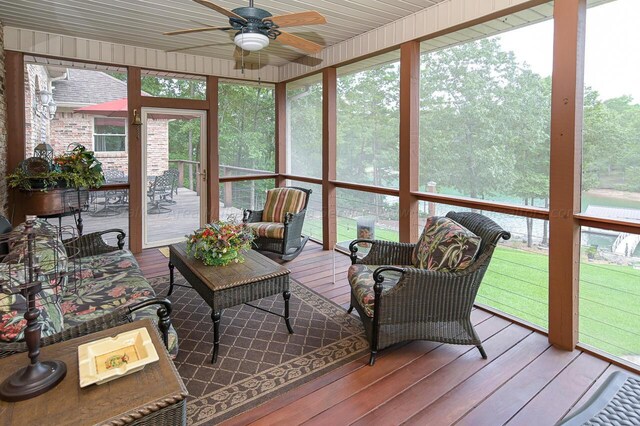 sunroom with a ceiling fan