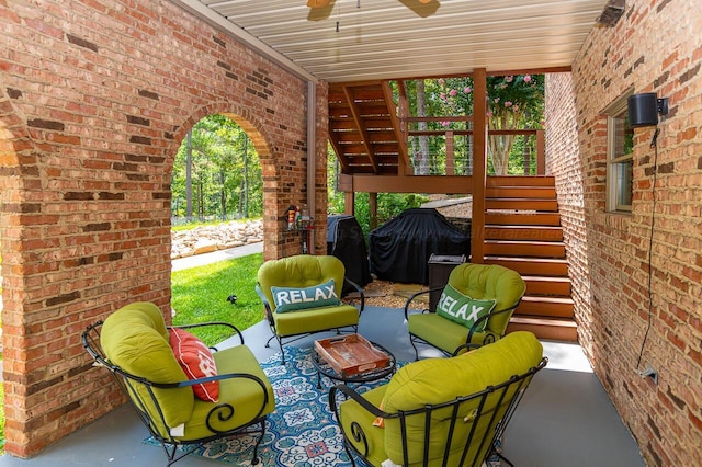 view of patio with ceiling fan and outdoor lounge area