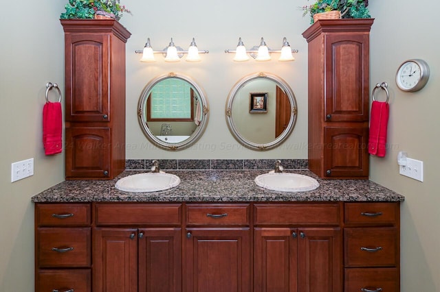 bathroom featuring a sink and double vanity