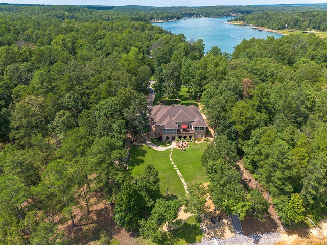 birds eye view of property featuring a wooded view and a water view