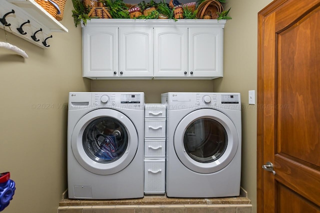 laundry area featuring cabinet space and separate washer and dryer