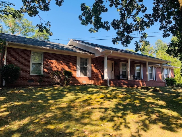 ranch-style home with a front yard