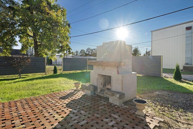 view of patio featuring an outdoor fireplace