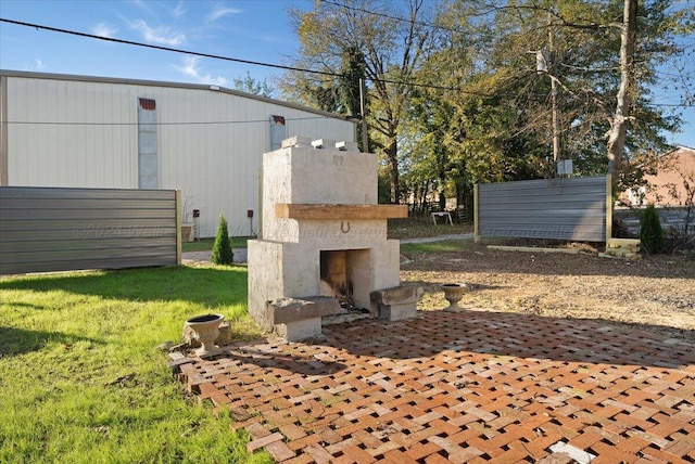 exterior space featuring an outdoor fireplace