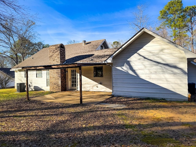 back of property featuring central air condition unit and a patio